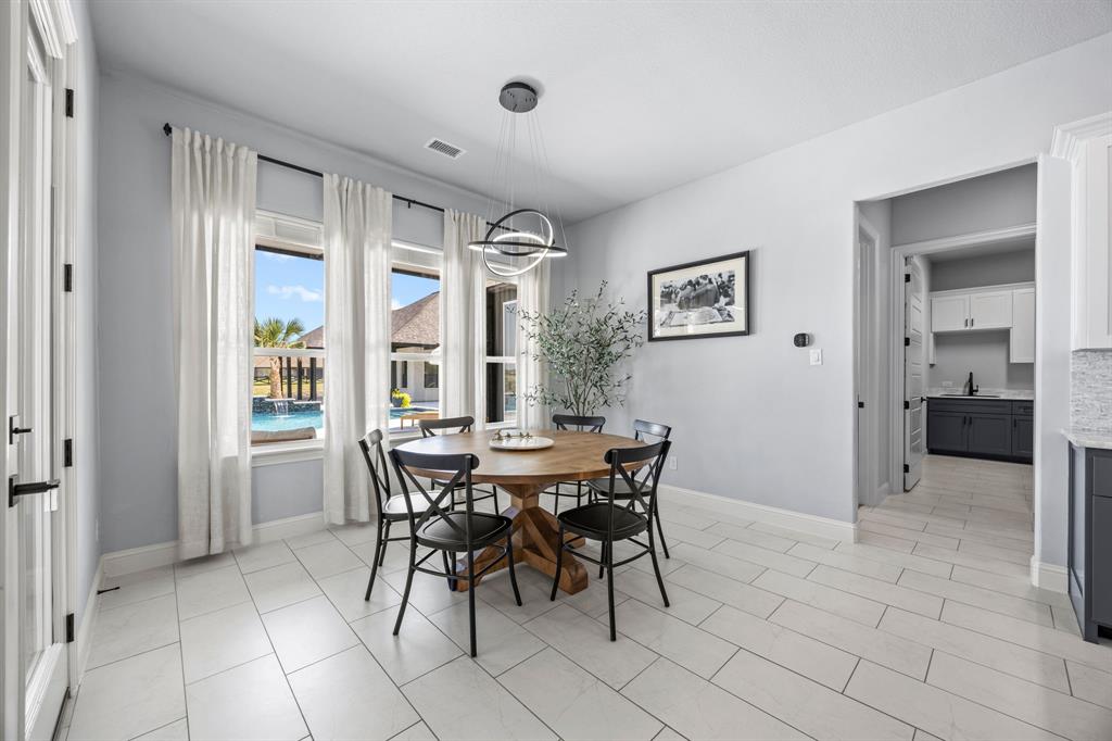 5707 Florance Road Northlake, TX 76226 - Photo 9 of 31 a view of a dining room with furniture and a window