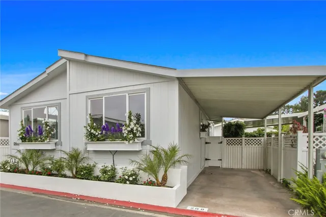 a view of a white house with many windows