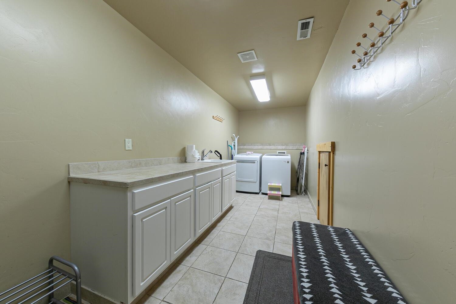 14070 Alder Creek Road Truckee, CA 96161 - Photo 17 of 28 a kitchen with a sink and cabinets