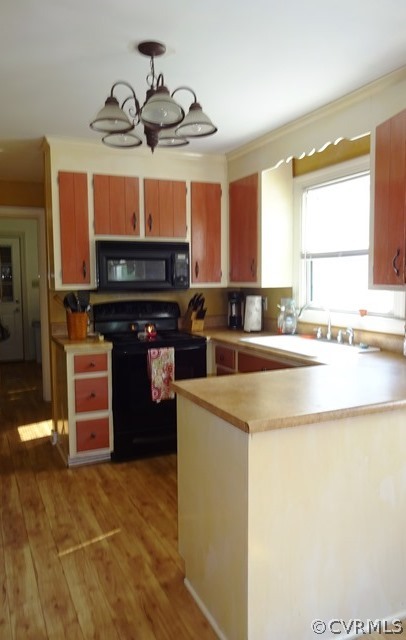 10705 Lunswood Road Chester, VA 23831 - Photo 11 of 22 Kitchen with Laminate Floor, Stove, Built in Micro