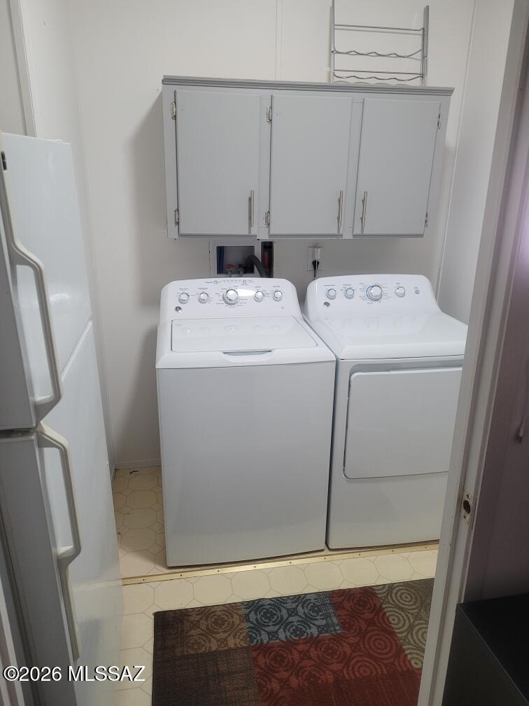 15770 North Oracle Road, Unit B4 Tucson, AZ 85739 - Photo 9 of 30 Laundry room off kitchen with extra refrigerator that stays