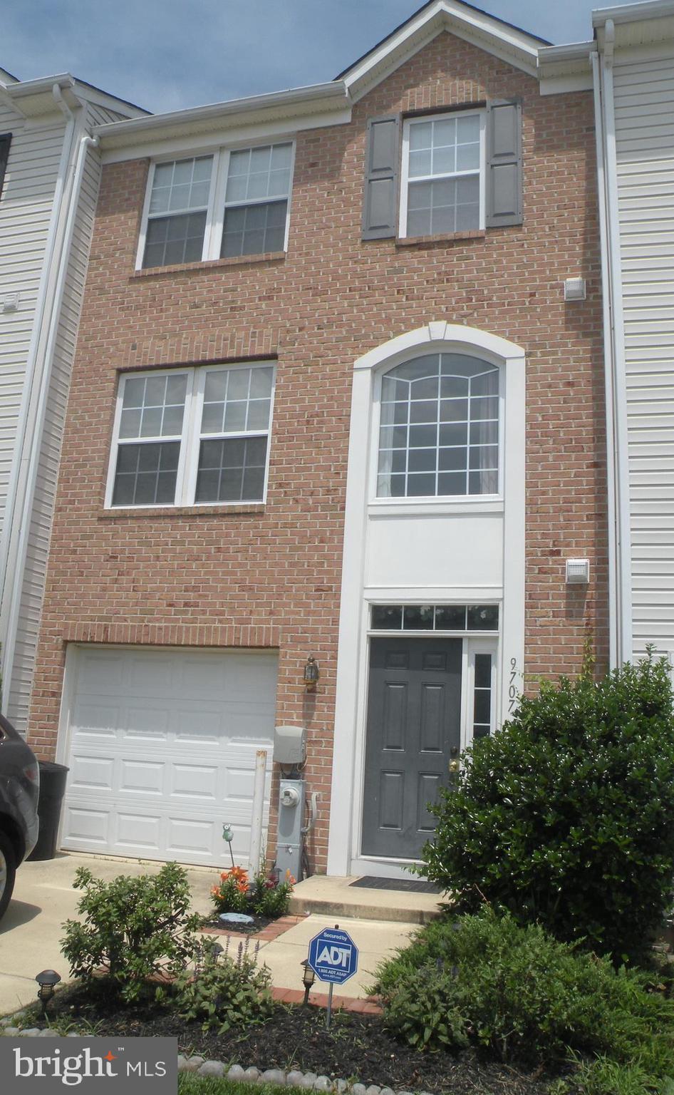 9707 Selfridge Road Baltimore, MD 21220 - Photo 1 of 1 a front view of a house with plants and garage