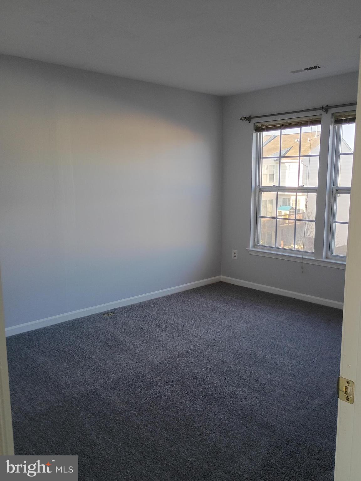 9707 Selfridge Road Baltimore, MD 21220 - Photo 16 of 22 an empty room with a window