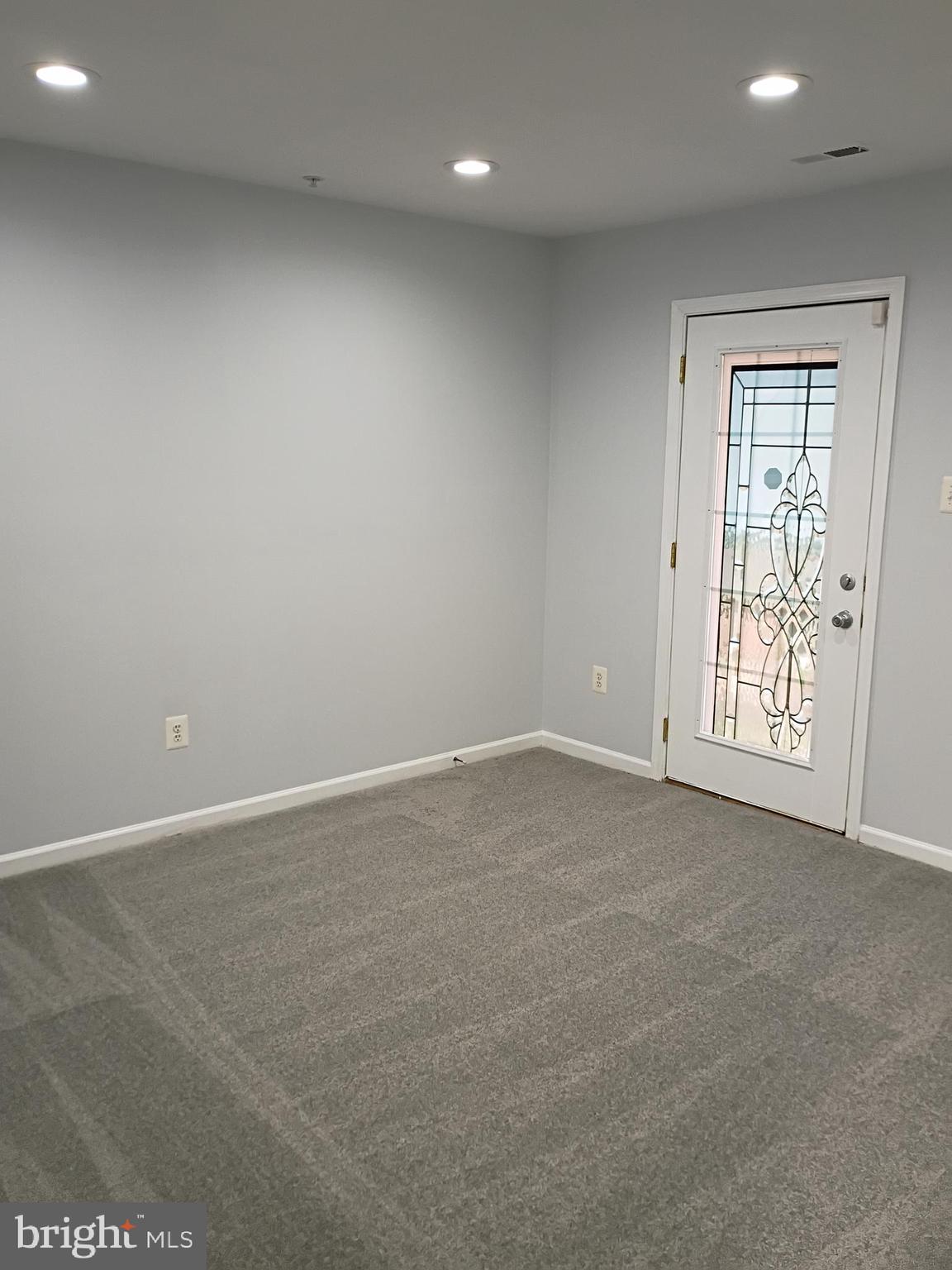 9707 Selfridge Road Baltimore, MD 21220 - Photo 7 of 22 an empty room with windows