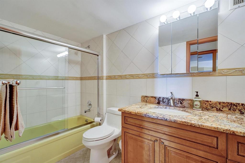 1000 South Ocean Boulevard, Unit 6M Pompano Beach, FL 33062 - Photo 14 of 31 a bathroom with a granite countertop sink a toilet a mirror and shower