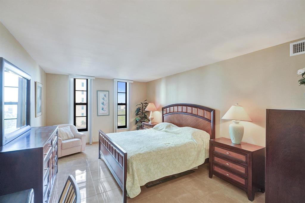 1000 South Ocean Boulevard, Unit 6M Pompano Beach, FL 33062 - Photo 19 of 31 a bedroom with a bed couch and a large window