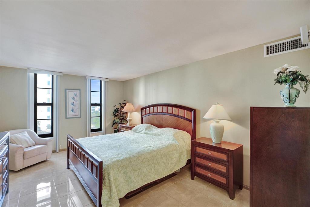 1000 South Ocean Boulevard, Unit 6M Pompano Beach, FL 33062 - Photo 21 of 31 a bedroom with a large bed and a couch