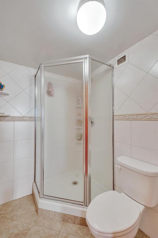 1000 South Ocean Boulevard, Unit 6M Pompano Beach, FL 33062 - Photo 24 of 31 a white toilet sitting next to a bathroom sink