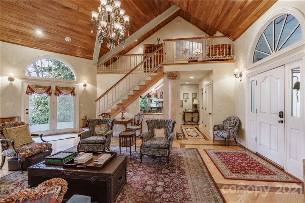 454 Cut Away Road Lake Lure, NC 28746 - Photo 20 of 48 a living room with furniture and a chandelier