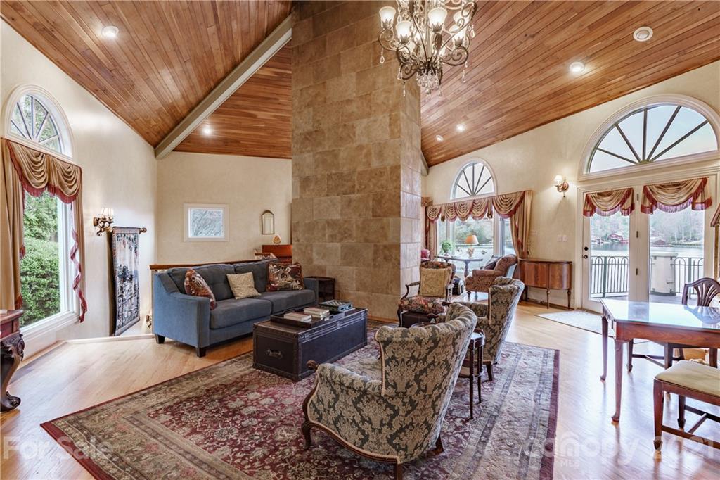 454 Cut Away Road Lake Lure, NC 28746 - Photo 21 of 48 a living room with furniture and a chandelier