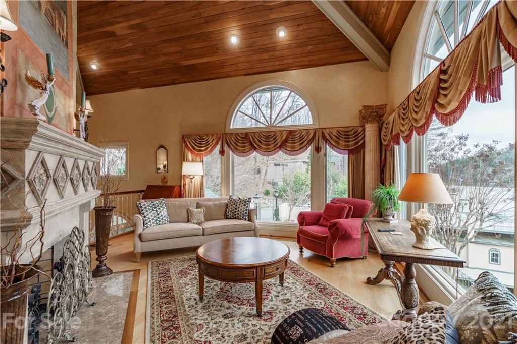 454 Cut Away Road Lake Lure, NC 28746 - Photo 22 of 48 a living room with furniture and a large window