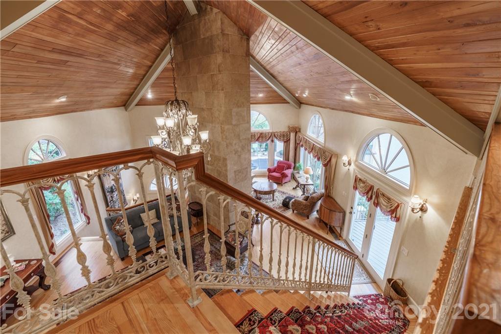 454 Cut Away Road Lake Lure, NC 28746 - Photo 31 of 48 a view of staircase with railing and a chandelier