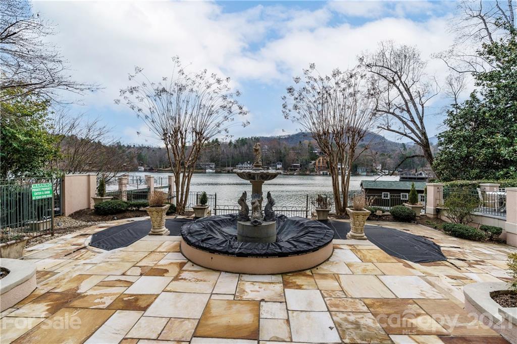 454 Cut Away Road Lake Lure, NC 28746 - Photo 8 of 48 a swimming pool with outdoor seating and plants