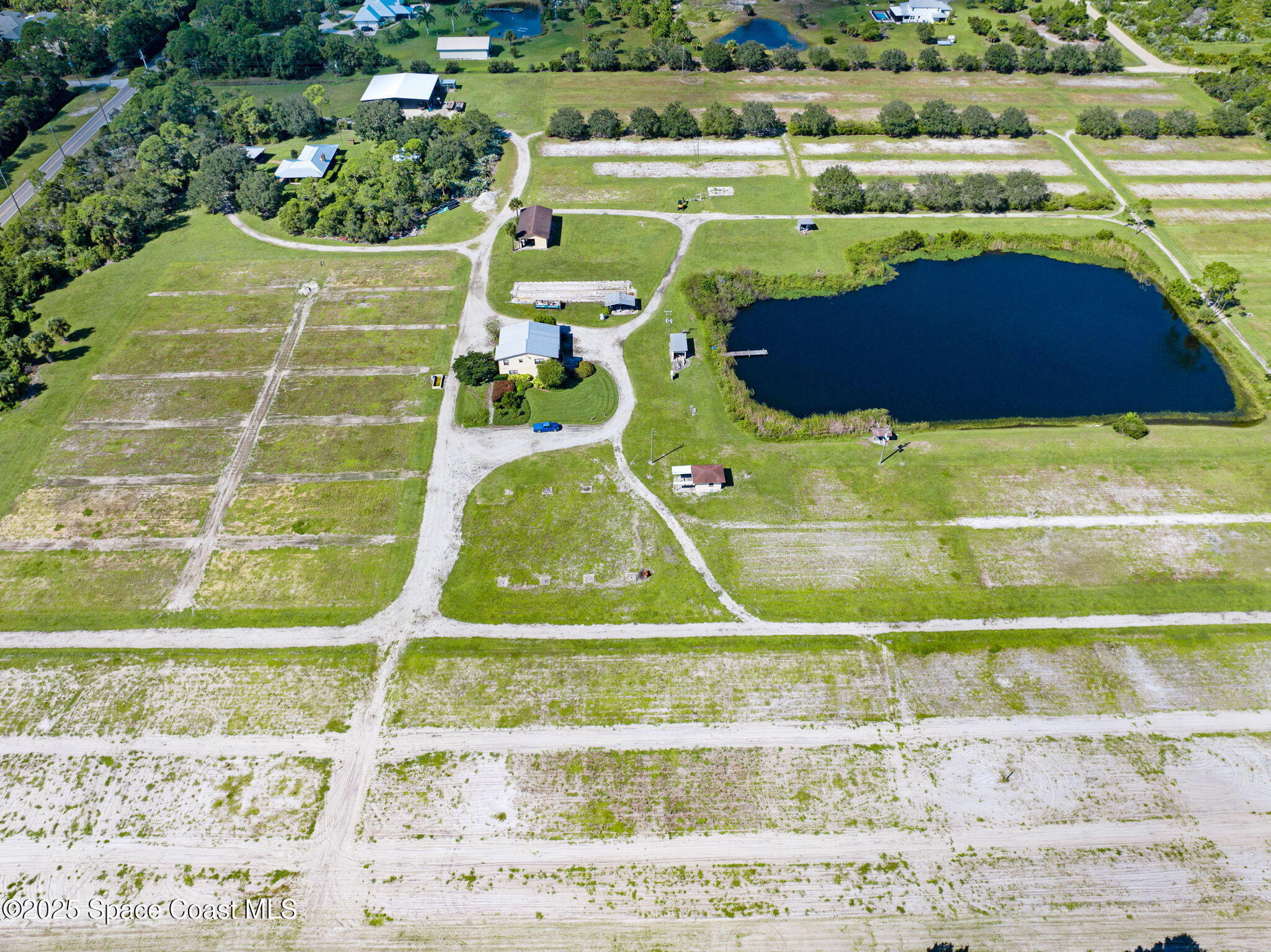 A Berry Road Grant Valkaria, FL 32949 - Photo 15 of 46 a view of a swimming pool and a yard