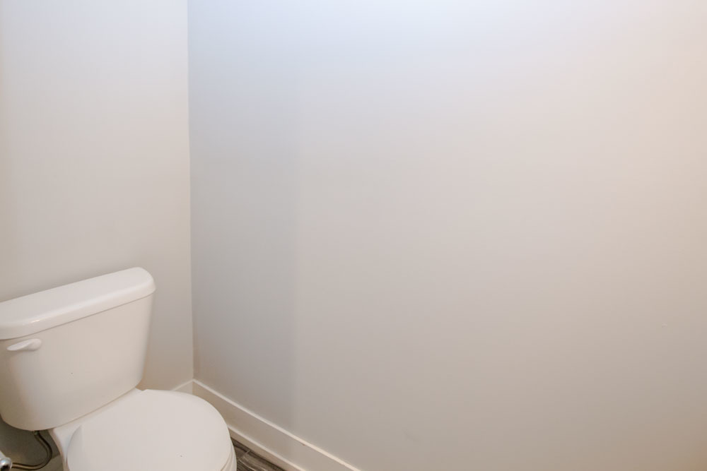 1202 Waukegan Road, Unit 410 Glenview, IL 60025 - Photo 12 of 15 a white toilet sitting next to a white wall