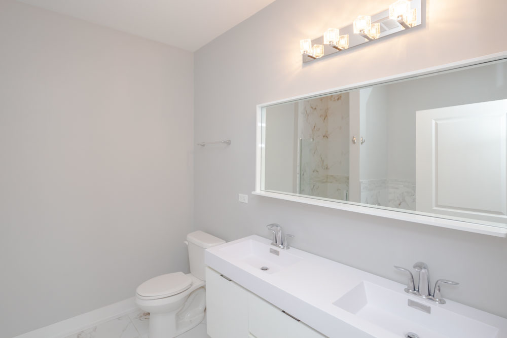 1202 Waukegan Road, Unit 410 Glenview, IL 60025 - Photo 14 of 15 a bathroom with a sink and a toilet
