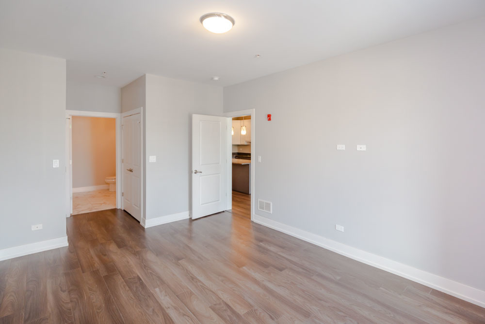 1202 Waukegan Road, Unit 410 Glenview, IL 60025 - Photo 6 of 15 wooden floor in an empty room