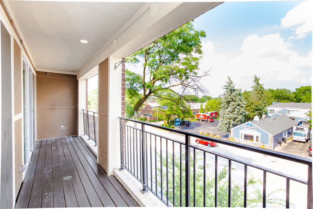 1202 Waukegan Road, Unit 410 Glenview, IL 60025 - Photo 9 of 15 a view of a balcony with wooden floor