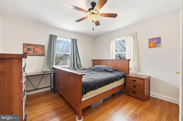 a bed room with a bed and a window