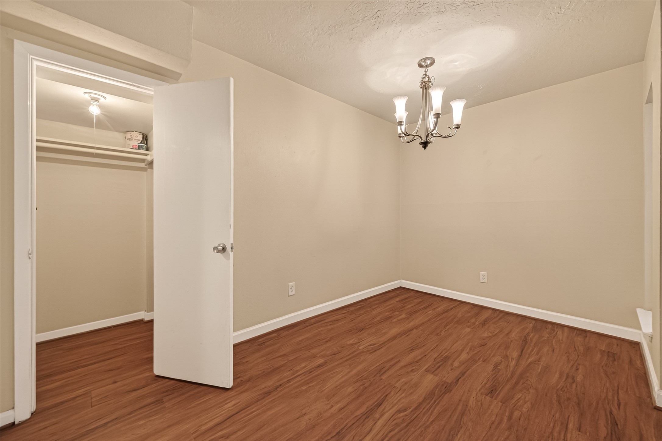 3400 Timmons Lane, Unit 31 Houston, TX 77027 - Photo 12 of 32 wooden floor in an empty room with a window