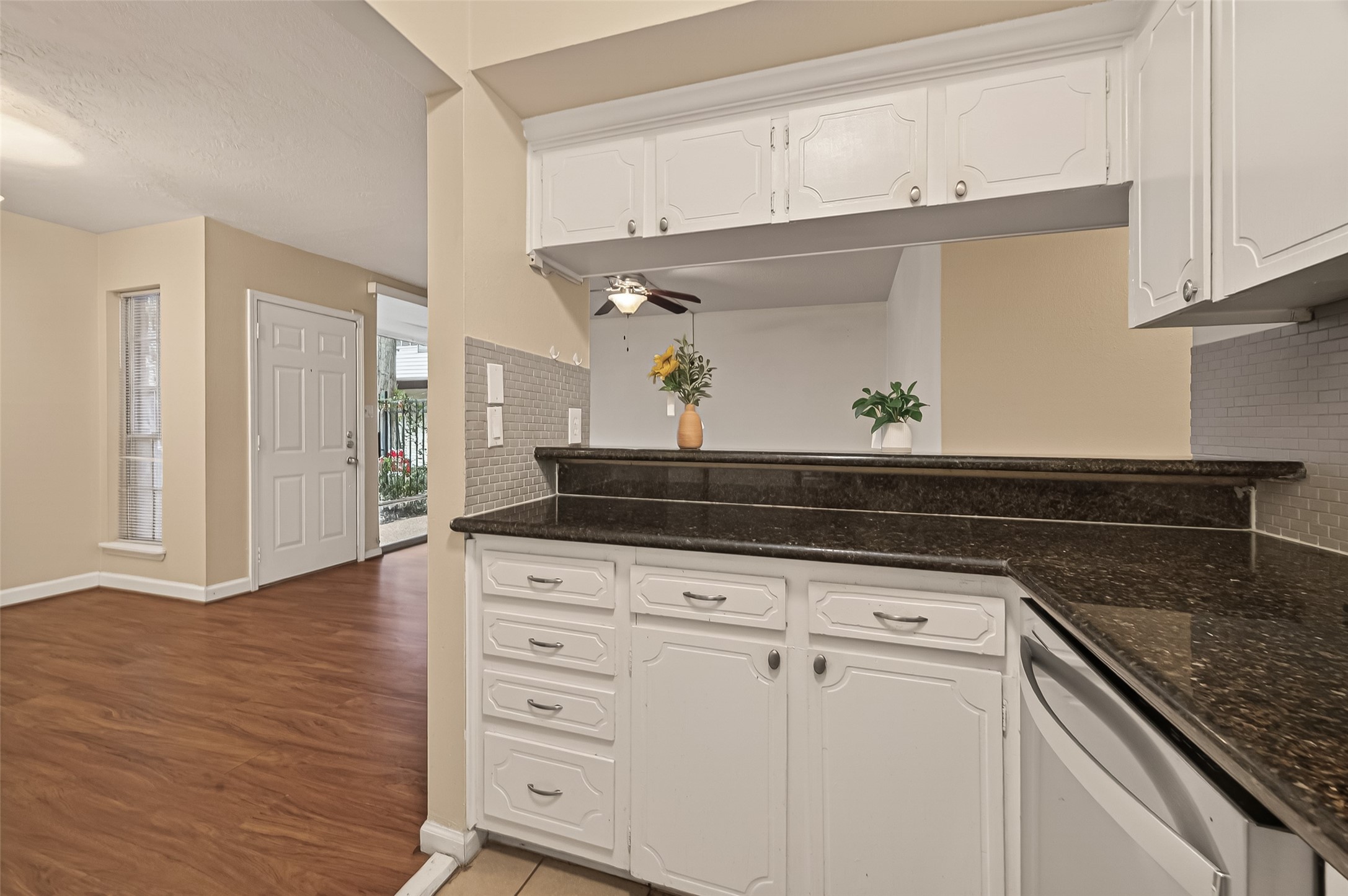 3400 Timmons Lane, Unit 31 Houston, TX 77027 - Photo 14 of 32 a kitchen with granite countertop white cabinets and a sink