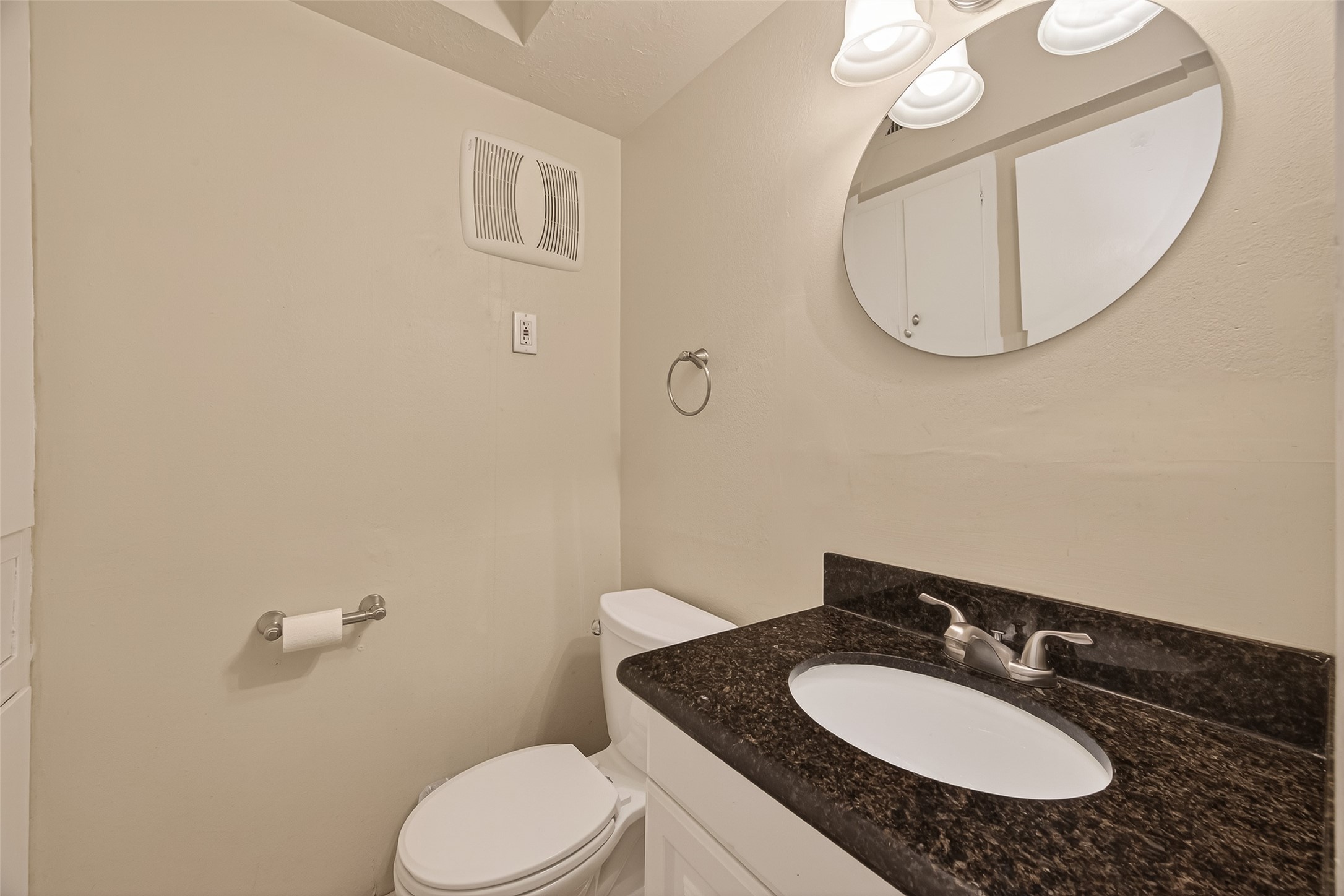 3400 Timmons Lane, Unit 31 Houston, TX 77027 - Photo 29 of 32 a bathroom with a granite countertop sink mirror and toilet