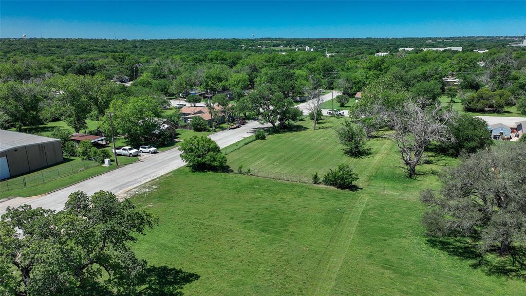 Tbd North Main Street Weatherford, TX 76086 - Photo 19 of 21 a view of a garden with a building in the background
