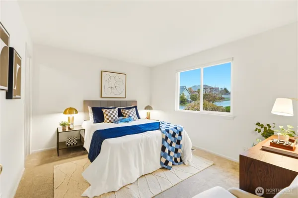a bedroom with a bed and a couch
