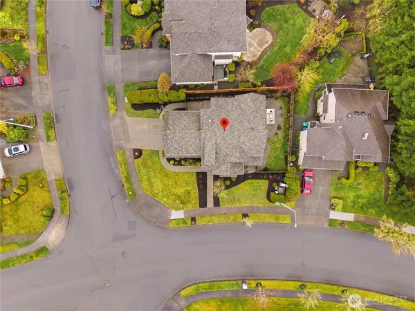 an aerial view of a house with swimming pool