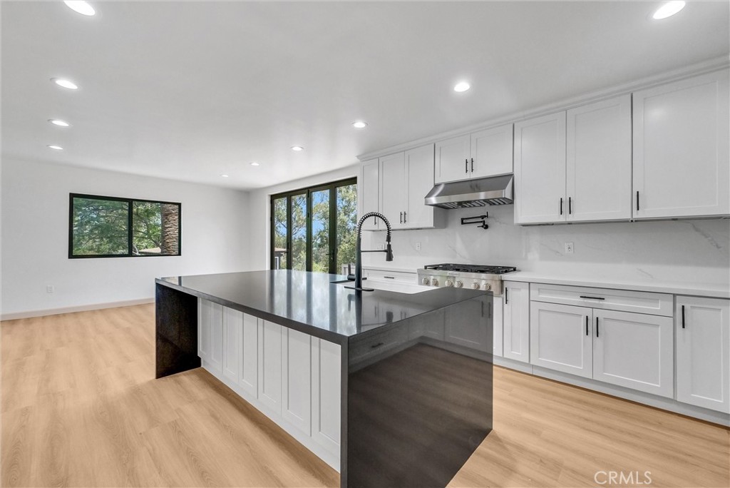 5090 Rockledge Drive Riverside, CA 92506 - Photo 14 of 40 a kitchen with counter top space cabinets and appliances