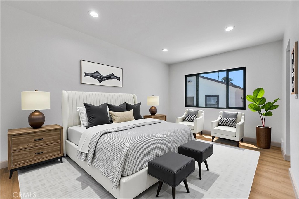 5090 Rockledge Drive Riverside, CA 92506 - Photo 16 of 40 a bedroom with bed and a couch