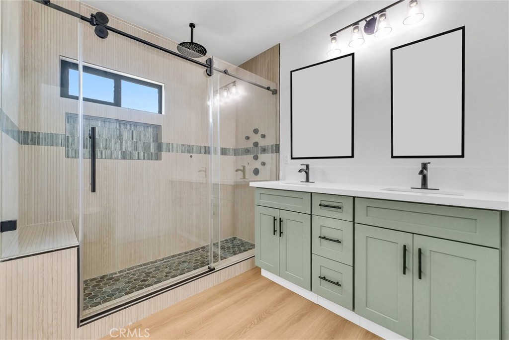 5090 Rockledge Drive Riverside, CA 92506 - Photo 19 of 40 a bathroom with a double vanity sink mirror and shower