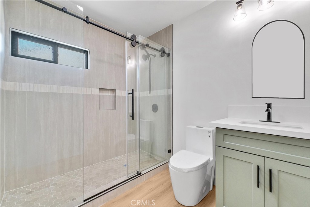 5090 Rockledge Drive Riverside, CA 92506 - Photo 26 of 40 a bathroom with a sink toilet and shower