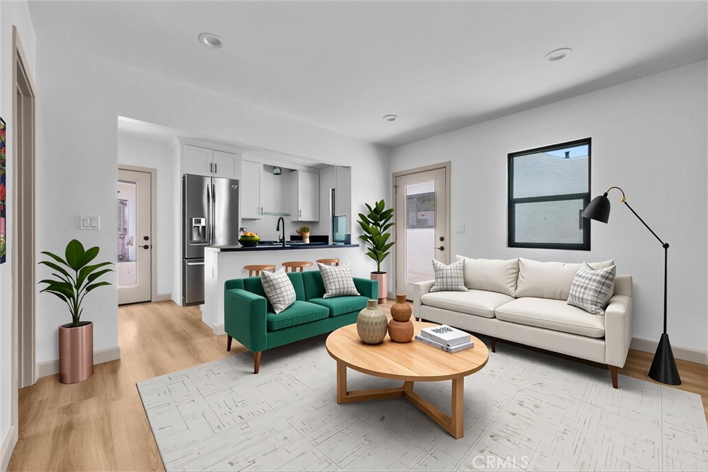 5090 Rockledge Drive Riverside, CA 92506 - Photo 29 of 40 a living room with furniture and a wooden floor