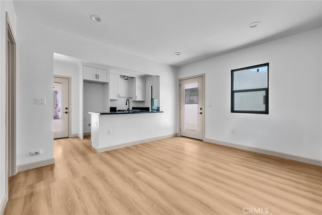 5090 Rockledge Drive Riverside, CA 92506 - Photo 30 of 40 a view of a kitchen with wooden floor and a sink