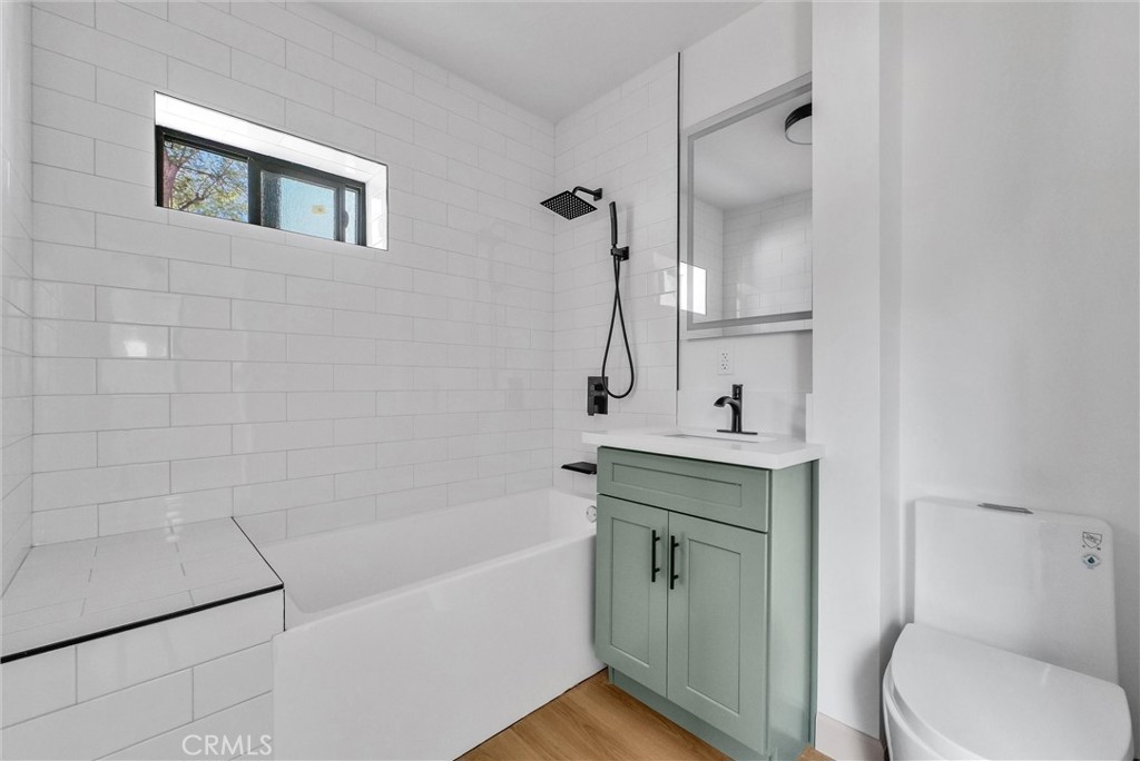 5090 Rockledge Drive Riverside, CA 92506 - Photo 36 of 40 a bathroom with a sink a toilet and shower