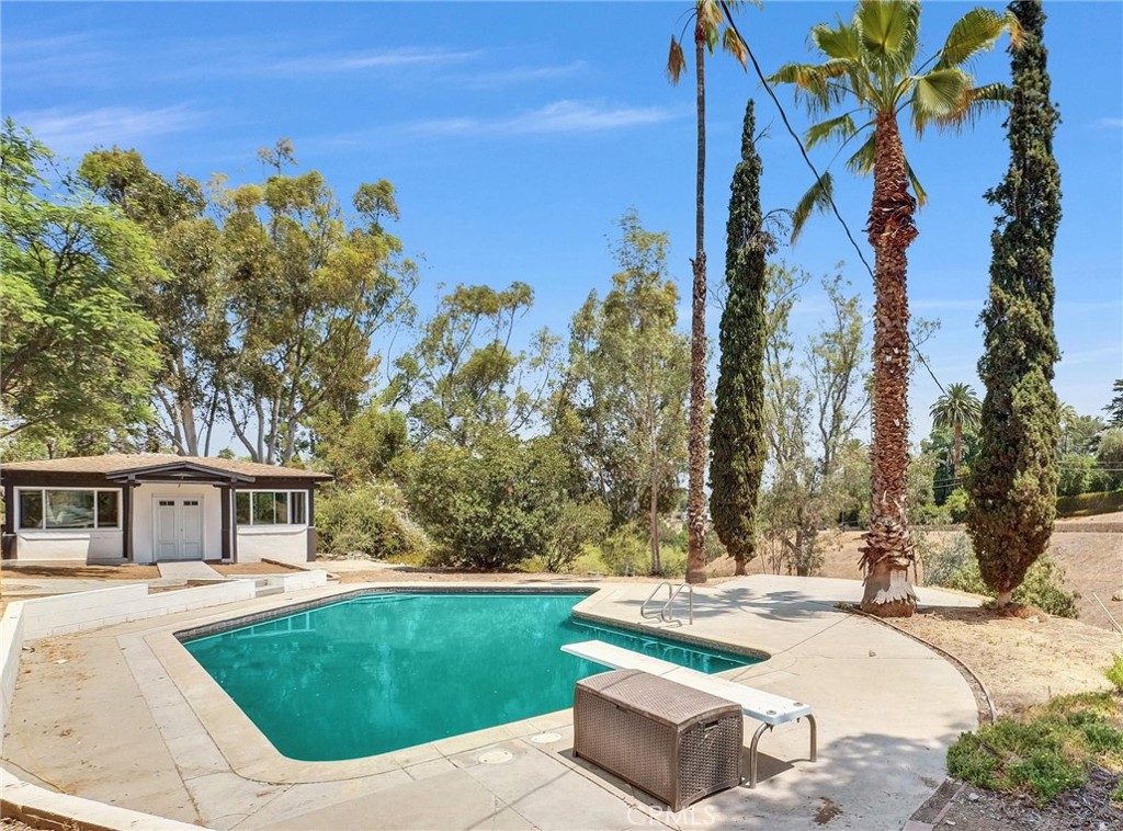5090 Rockledge Drive Riverside, CA 92506 - Photo 37 of 40 a view of a house with backyard porch and sitting area