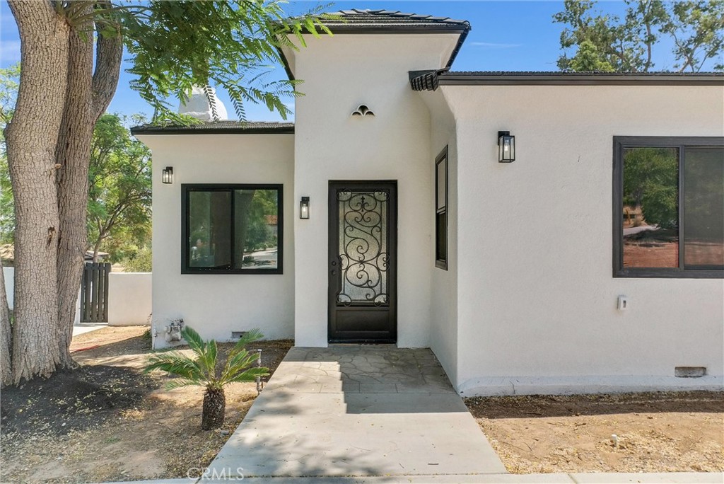 5090 Rockledge Drive Riverside, CA 92506 - Photo 4 of 40 a front view of a house with garden