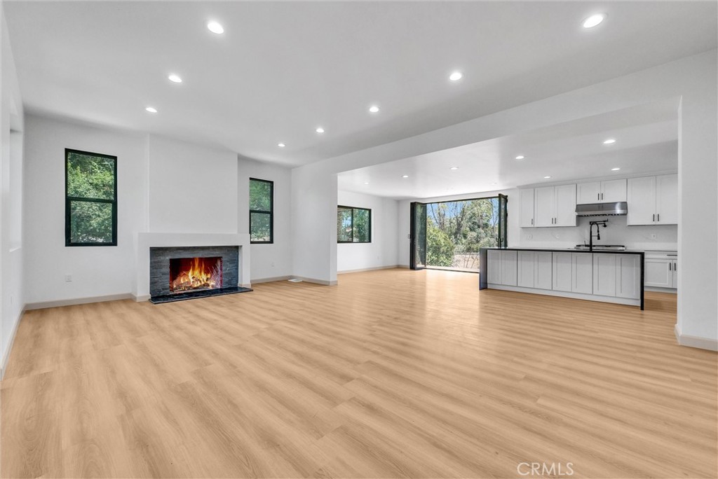 5090 Rockledge Drive Riverside, CA 92506 - Photo 5 of 40 a view of a living room a fireplace with wooden floor