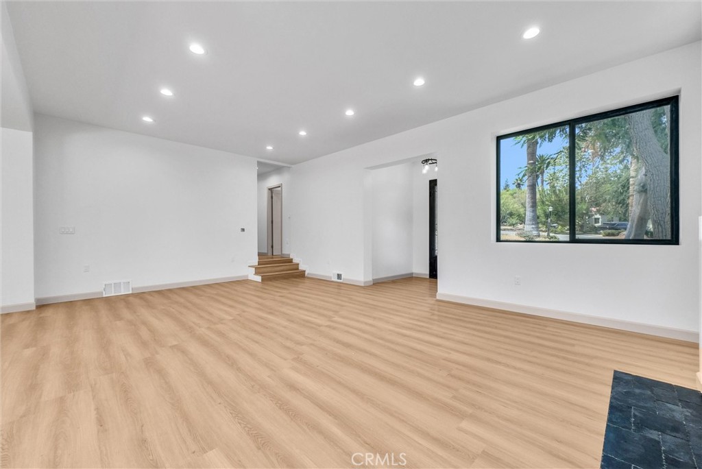 5090 Rockledge Drive Riverside, CA 92506 - Photo 8 of 40 a view of empty room with wooden floor and fan