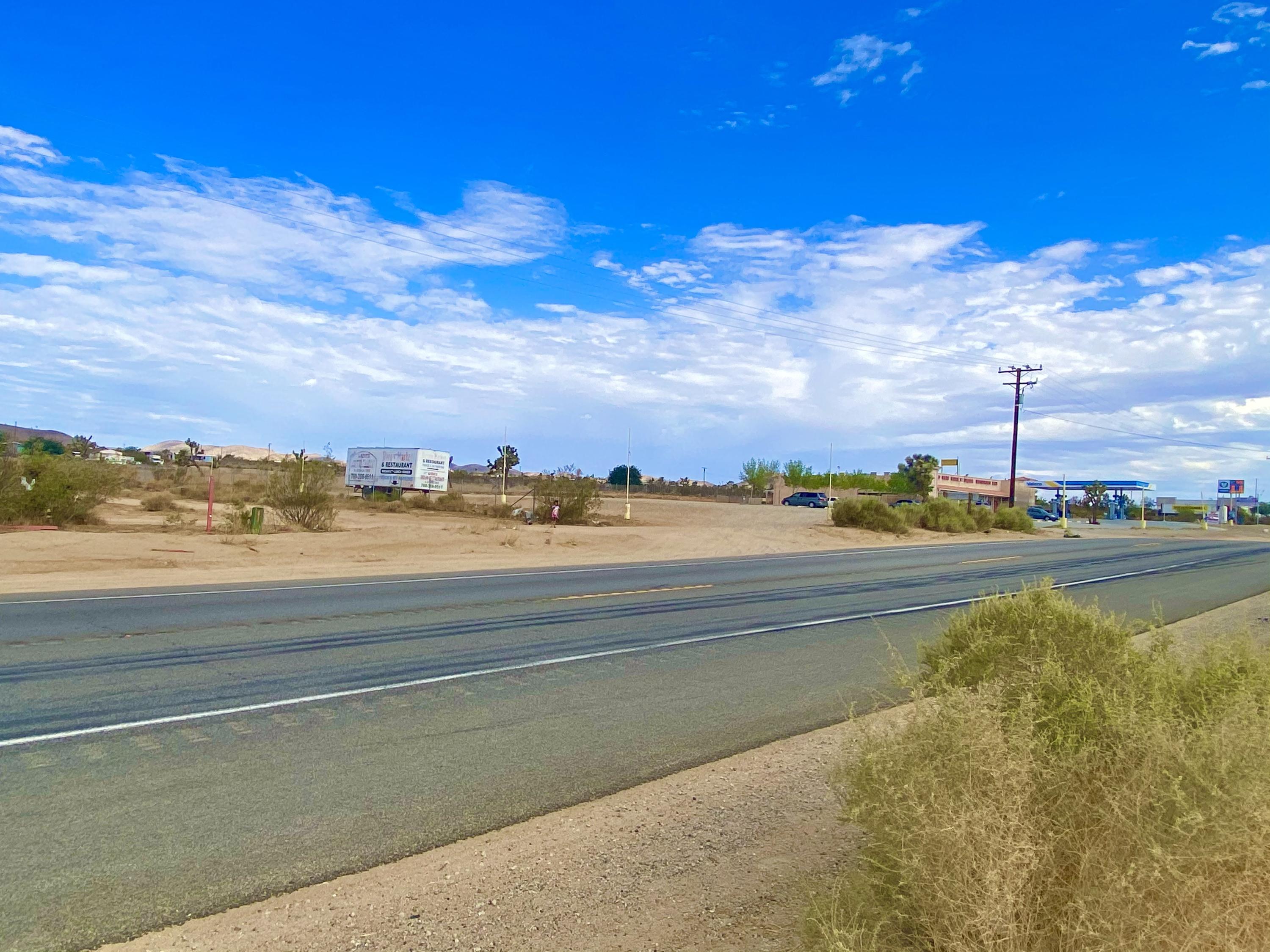 152 Old Woman Springs Road Yucca Valley, CA 92284 - Photo 2 of 32 a view of an ocean and beach