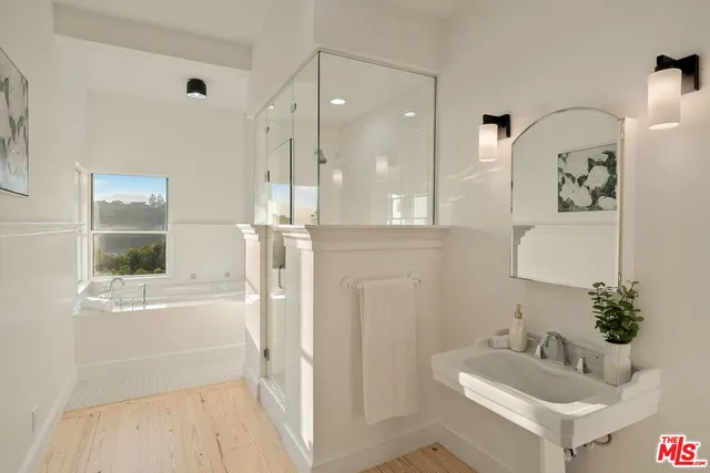 a bath tub sitting next to a window