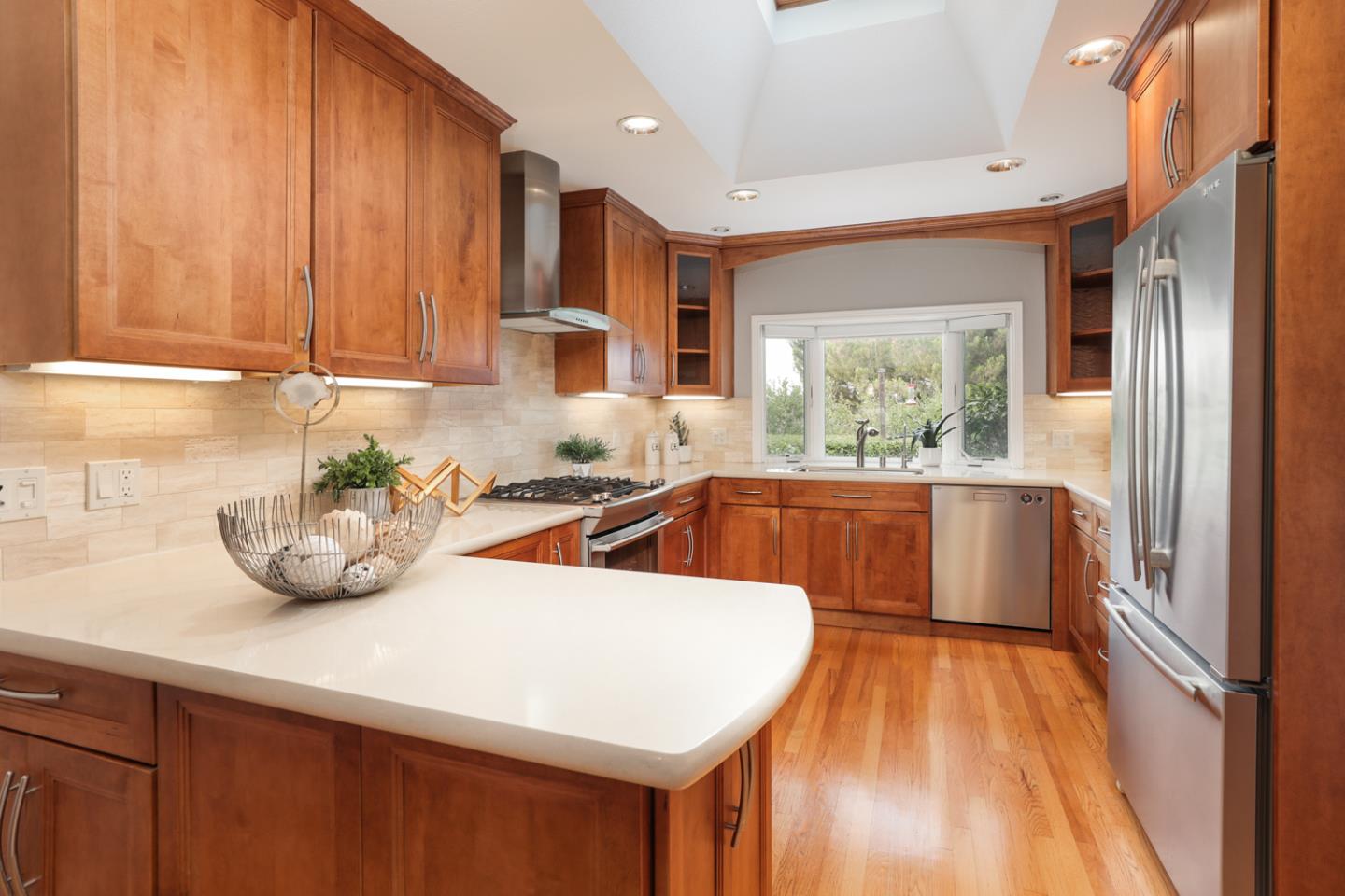 2250 Vía Maderos Los Altos, CA 94024 - Photo 11 of 36 a kitchen with stainless steel appliances a sink a counter top space and a window