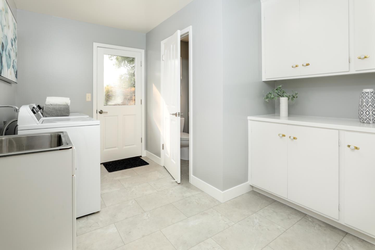 2250 Vía Maderos Los Altos, CA 94024 - Photo 12 of 36 a view of a kitchen with white cabinets and white appliances