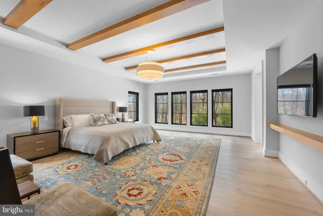 a bedroom with a large bed and a window