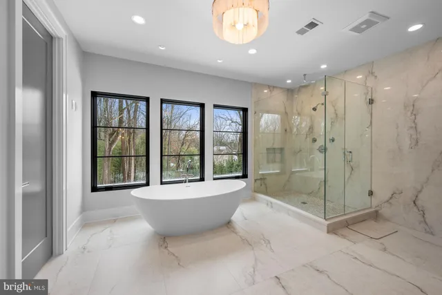 a bathroom with a bathtub and shower
