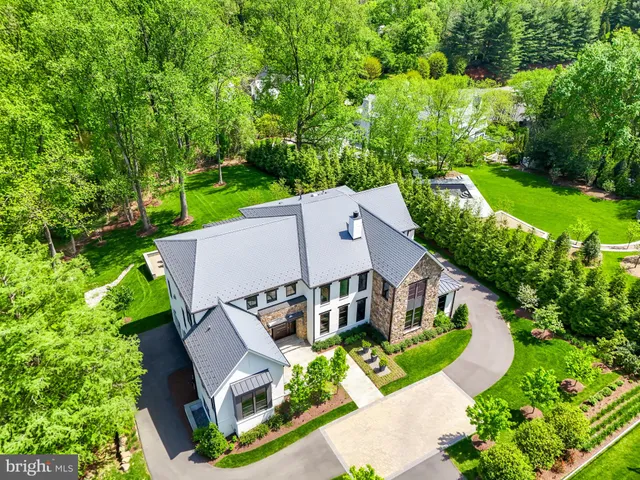 an aerial view of a house with a garden