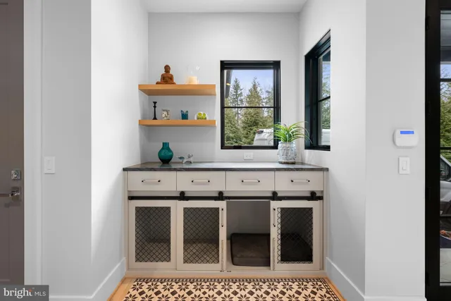 a bathroom with a granite countertop toilet a sink and a mirror
