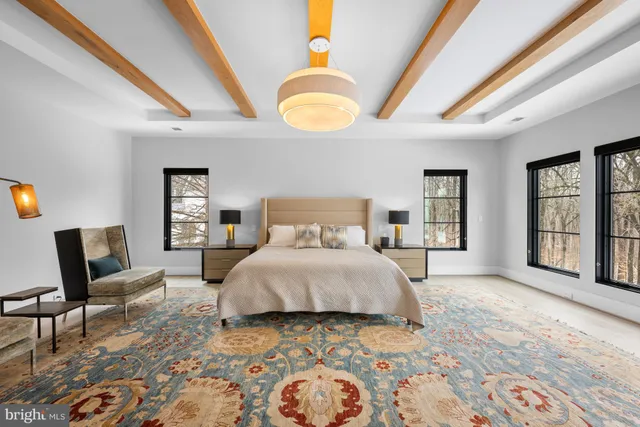a spacious bathroom with a double vanity sink and a mirror