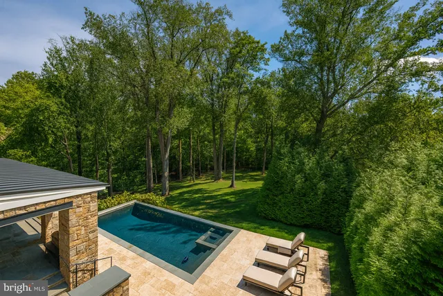 a view of a patio with table and chairs and potted plants